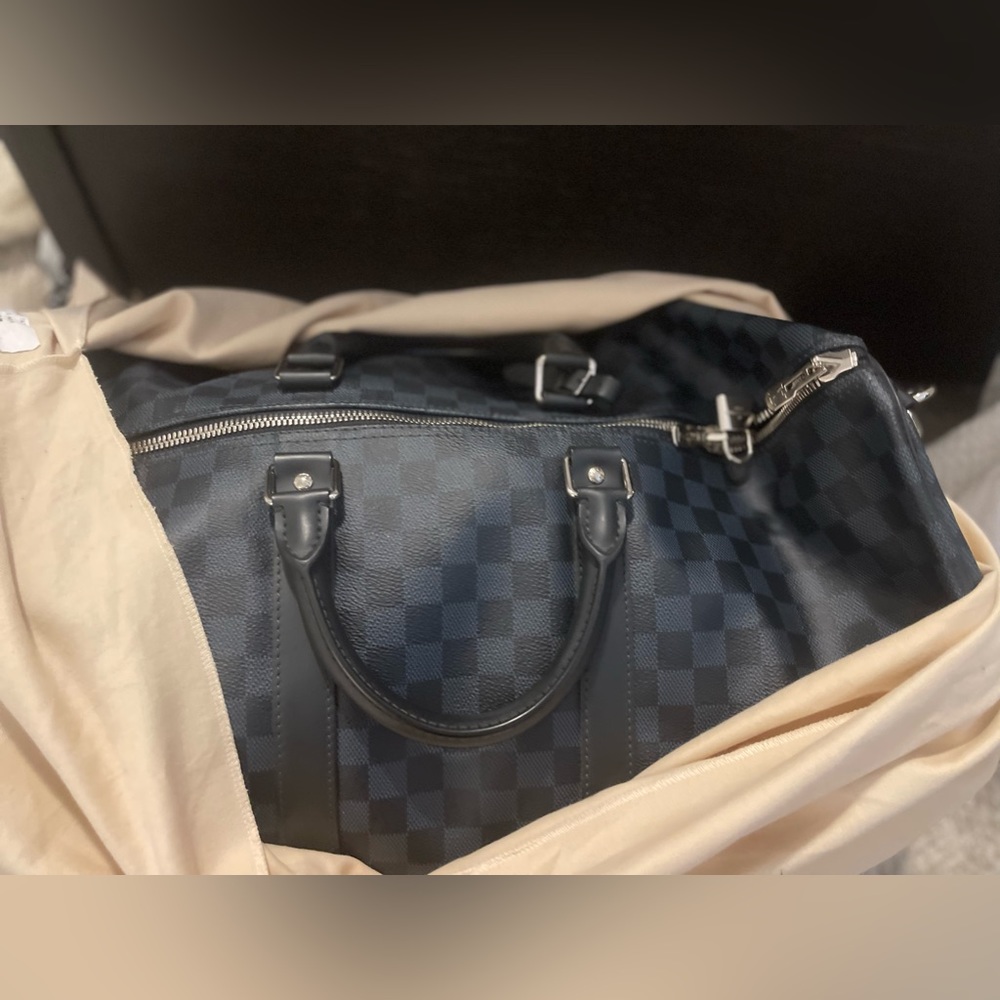 KEEPALL BANDOULIÈRE 55,
Monogram Eclipse